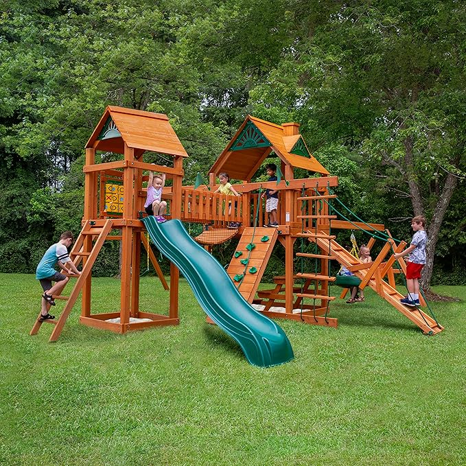 Gorilla Playsets Pioneer Peak Treehouse Wooden Swing Set with Tire Swing, and Clatter Bridge and Tower